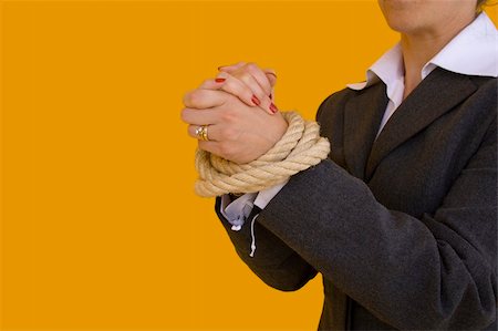 a business woman with her hands tied for a corporate crime Foto de stock - Super Valor sin royalties y Suscripción, Código: 400-04467541