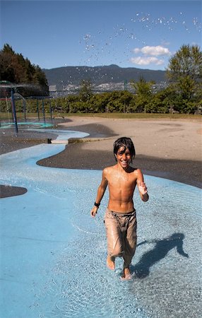 boy running in water in water park Stock Photo - Budget Royalty-Free & Subscription, Code: 400-04467624