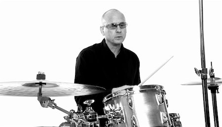simsearch:400-06133570,k - shot of drummer playing over white backdrop Stock Photo - Budget Royalty-Free & Subscription, Code: 400-04467705