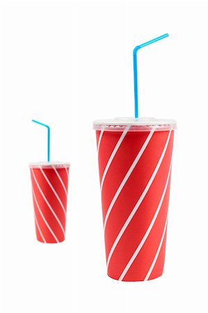 A two soda drinks with blue straw, isolated on white background. Focus at front Stock Photo - Budget Royalty-Free & Subscription, Code: 400-04467938