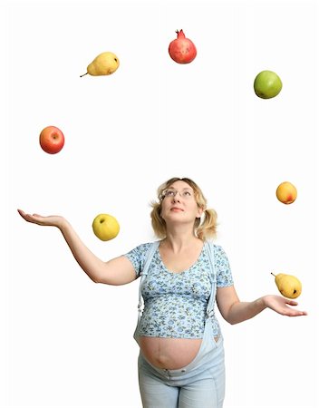 The Expectant mother tosses and caughts the fruits on white background. Fotografie stock - Microstock e Abbonamento, Codice: 400-04468212