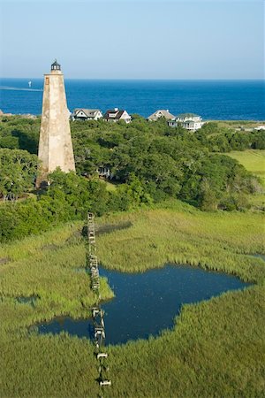 Aerial view of Old Baldy lighthouse in marshy lowlands of Bald Head Island, North Carolina. Stock Photo - Budget Royalty-Free & Subscription, Code: 400-04468771