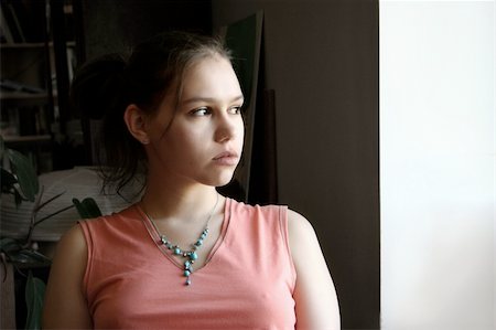 simsearch:400-06875322,k - Unhappy teenage girl by the window Stock Photo - Budget Royalty-Free & Subscription, Code: 400-04468937
