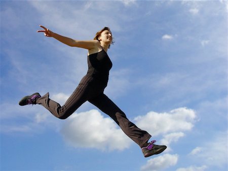 female athletic high jump - Young woman jumping high in the air Stock Photo - Budget Royalty-Free & Subscription, Code: 400-04468932