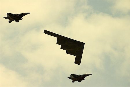 stealth fighter - Americas amazing stealth bomber accompanied by two fighter jets Stock Photo - Budget Royalty-Free & Subscription, Code: 400-04468953