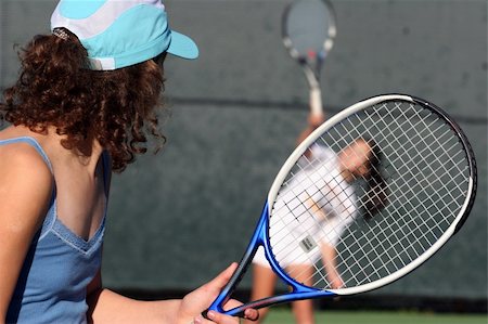 doubles tennis players - Two girls playing tennis Stock Photo - Budget Royalty-Free & Subscription, Code: 400-04469348