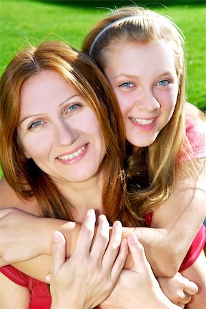 simsearch:400-04612785,k - Portrait of a smiling mother and teenage daughter in summer park Stock Photo - Budget Royalty-Free & Subscription, Code: 400-04469464