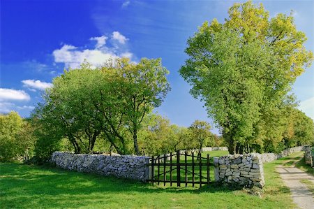 stone walls in meadows - Closed wooden gate in a stone wall Stock Photo - Budget Royalty-Free & Subscription, Code: 400-04469775