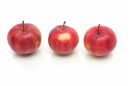 Three red apples on a white background Stockbilder - Microstock & Abonnement, Bildnummer: 400-04469817