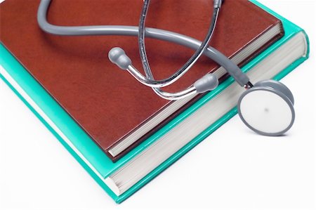 stethoscope on books - Stethoscope on a medical book Stock Photo - Budget Royalty-Free & Subscription, Code: 400-04460189