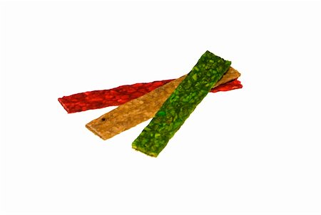 red, green and yellow dog treats isolated on the white background Foto de stock - Royalty-Free Super Valor e Assinatura, Número: 400-04460297
