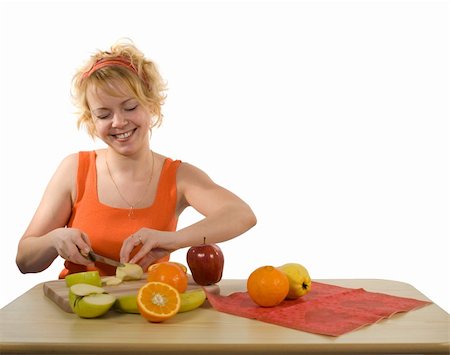 pretty women eating banana - Young blond, happy and healthy looking woman preparing fruit salad (isolated, with copy space) Photographie de stock - Aubaine LD & Abonnement, Code: 400-04460982