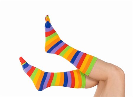 Beautiful woman or girl legs in funny and vivid color socks (isolated) Stock Photo - Budget Royalty-Free & Subscription, Code: 400-04460990