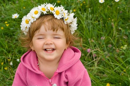 simsearch:400-06087517,k - Happy laughing girl with daisy wreath on the spring meadow Stock Photo - Budget Royalty-Free & Subscription, Code: 400-04461111