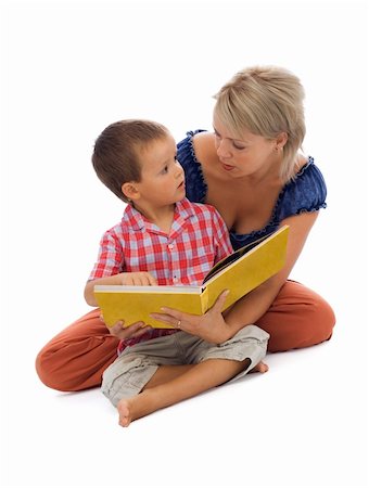 Young boy and his mother reading a story together - isolated on white with a bit of shadow Stock Photo - Budget Royalty-Free & Subscription, Code: 400-04461144