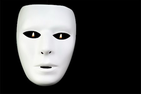 A full face white mask taken on a black background with tiny flames visible through the eyes. Stock Photo - Budget Royalty-Free & Subscription, Code: 400-04461393