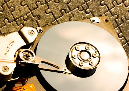 electronics jigsaw puzzle - Hard disk is the brain of computer. Stock Photo - Budget Royalty-Free & Subscription, Code: 400-04461686