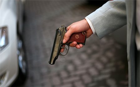 simsearch:400-08040909,k - The person in a grey suit with a pistol Stock Photo - Budget Royalty-Free & Subscription, Code: 400-04463790