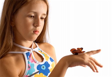 Portrait of girl with artificial butterfly. Isolated on white. Foto de stock - Super Valor sin royalties y Suscripción, Código: 400-04463992