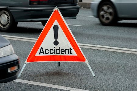 A traffic accident sign in the middle of a busy road, cars passing on either side. Motion blur on the cars. Stock Photo - Budget Royalty-Free & Subscription, Code: 400-04474031