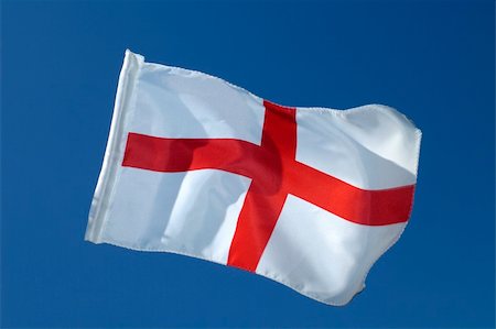 simsearch:622-02621533,k - The cross of St George, the flag of England, isolated against a clear blue sky. Motion blur at the tip of the flag. Stock Photo - Budget Royalty-Free & Subscription, Code: 400-04474041