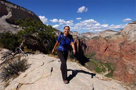 simsearch:400-08713043,k - Woman hiking Angels Landing in Zion National Park Fotografie stock - Microstock e Abbonamento, Codice: 400-04474650