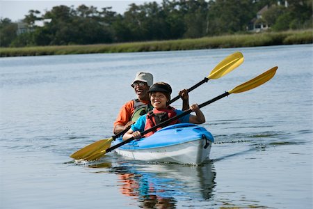 portrait and kayak - African American middle-aged couple smiling and paddling kayak. Stock Photo - Budget Royalty-Free & Subscription, Code: 400-04475188