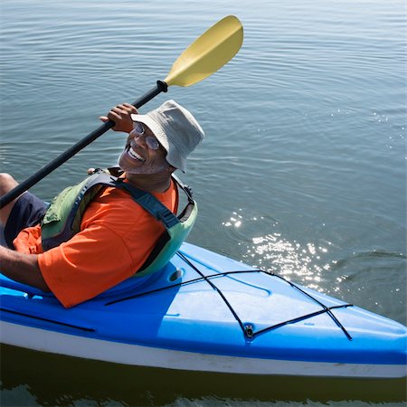 African American middle-aged man smiling at viewer in kayak. Stock Photo - Budget Royalty-Free & Subscription, Code: 400-04475191
