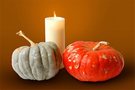 Pumpkins and candle over an organic background. Foto de stock - Royalty-Free Super Valor e Assinatura, Número: 400-04475309