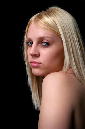 Portrait of blond woman with blue eyes isolated over black background. Foto de stock - Royalty-Free Super Valor e Assinatura, Número: 400-04475314