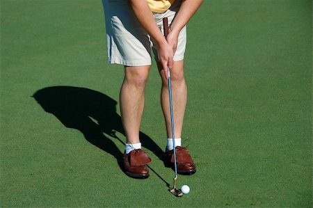 Golfer putting on the green Foto de stock - Royalty-Free Super Valor e Assinatura, Número: 400-04475326