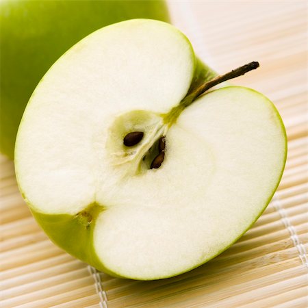 Close up of sliced green apple. Stock Photo - Budget Royalty-Free & Subscription, Code: 400-04475704