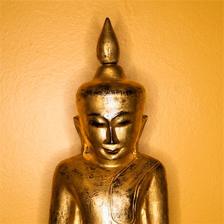 simsearch:400-03944899,k - Golden wooden Buddha statue from Burma against yellow wall. Stock Photo - Budget Royalty-Free & Subscription, Code: 400-04475800