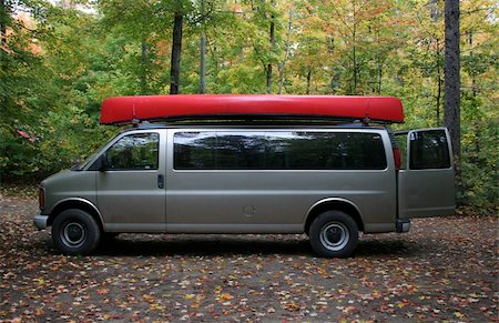 A large van with a canoe on top, shot against the fall forest. Stock Photo - Budget Royalty-Free & Subscription, Code: 400-04475863