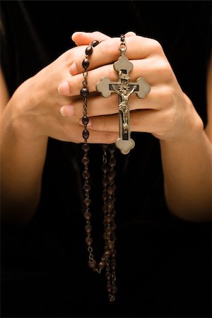 Woman holding rosary with crucifix. Stock Photo - Budget Royalty-Free & Subscription, Code: 400-04476079