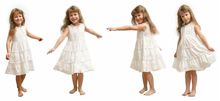 The Small girl in white gown spins, jumps, playing, smiling,  pose on white background. Fotografie stock - Microstock e Abbonamento, Codice: 400-04476239