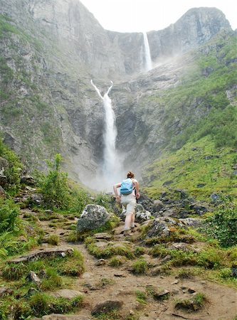 simsearch:400-03946853,k - The long Eikesdalsvatnet lake lies just 26 metres above sea level, while the surrounding mountains tower to heights of 1,500 to 1,800 metres straight up from the lake. The Mardalsfossen waterfall cascades 297 metres down into the valley and is the fourth highest waterfall in the world (the whole waterfall is 655 m). The waterfall is an impressive sight in the period when the water is released by t Stockbilder - Microstock & Abonnement, Bildnummer: 400-04476536
