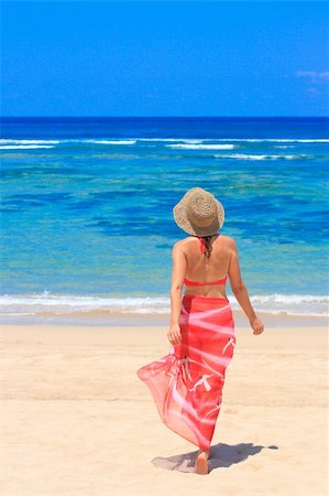 Young female in pareo walking towards the sea Stock Photo - Budget Royalty-Free & Subscription, Code: 400-04476729