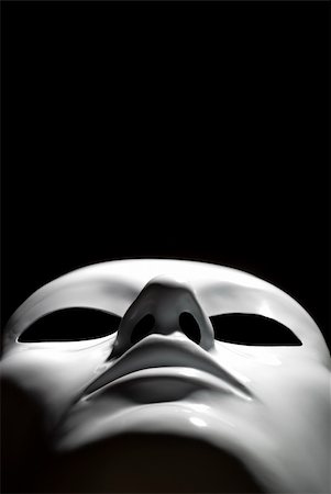 Suggestive simple white mask on black background Stock Photo - Budget Royalty-Free & Subscription, Code: 400-04476796