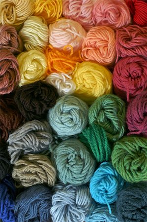 Practical and colorful storage of skeins of yarn being used for different knitting, crocheting, and needle-point canvas projects. Photographie de stock - Aubaine LD & Abonnement, Code: 400-04476826