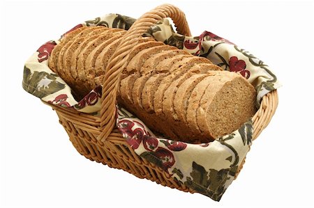 Multi grain loaf in a basket.  Homemade with 100% organic ingredients: whole wheat, buckwheat, rye & barley flour, sesame seed, sunflower seed, rolled oats, molasses, rock salt, yeast & water. Photographie de stock - Aubaine LD & Abonnement, Code: 400-04476827