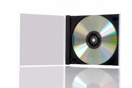 simsearch:400-03950272,k - a compact disc in the box, isolated on white background with reflection Photographie de stock - Aubaine LD & Abonnement, Code: 400-04477497