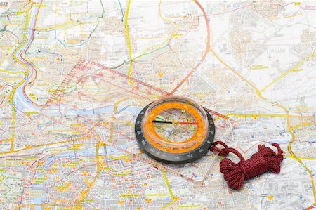 a compass lying on a map - close up Stock Photo - Budget Royalty-Free & Subscription, Code: 400-04477660