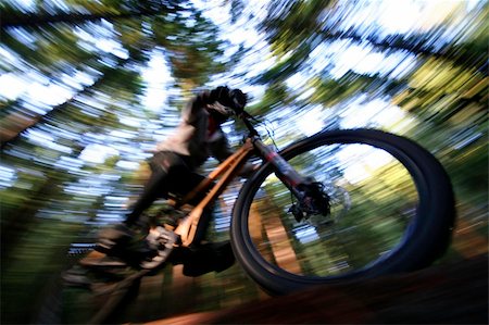 A heavily blurred mountain biker on a trail in Vancouvers famous North Shore mountains. Stock Photo - Budget Royalty-Free & Subscription, Code: 400-04477714