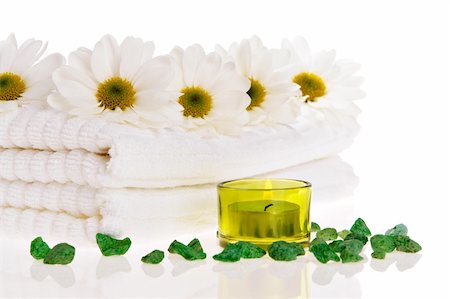 simsearch:400-05326817,k - Towels, candle, and daisies on white isolated Stock Photo - Budget Royalty-Free & Subscription, Code: 400-04478272