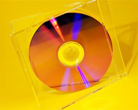 simsearch:400-03909479,k - Cd inside cd case on yellow background Foto de stock - Super Valor sin royalties y Suscripción, Código: 400-04478285