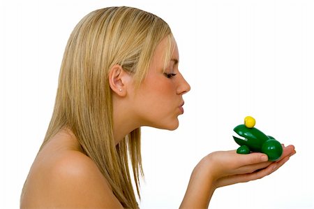 A gorgeous young blond woman kissing a toy frog Stock Photo - Budget Royalty-Free & Subscription, Code: 400-04479087