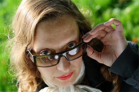 simsearch:400-05051542,k - Business woman removing her dark glasses and looking at you from the top of her glasses. Stock Photo - Budget Royalty-Free & Subscription, Code: 400-04479585