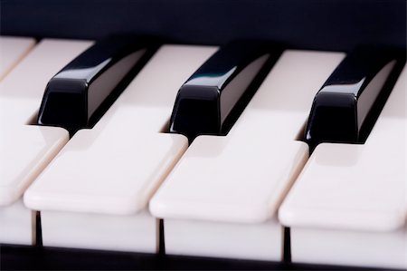 simsearch:400-08163199,k - Partial view of a piano keyboard. Macro shot. Shallow depth of field. Stock Photo - Budget Royalty-Free & Subscription, Code: 400-04479846