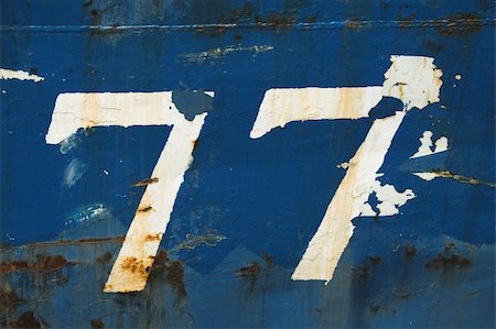 quevaal (artist) - Number 77 on the side of a boat Stockbilder - Microstock & Abonnement, Bildnummer: 400-04470040